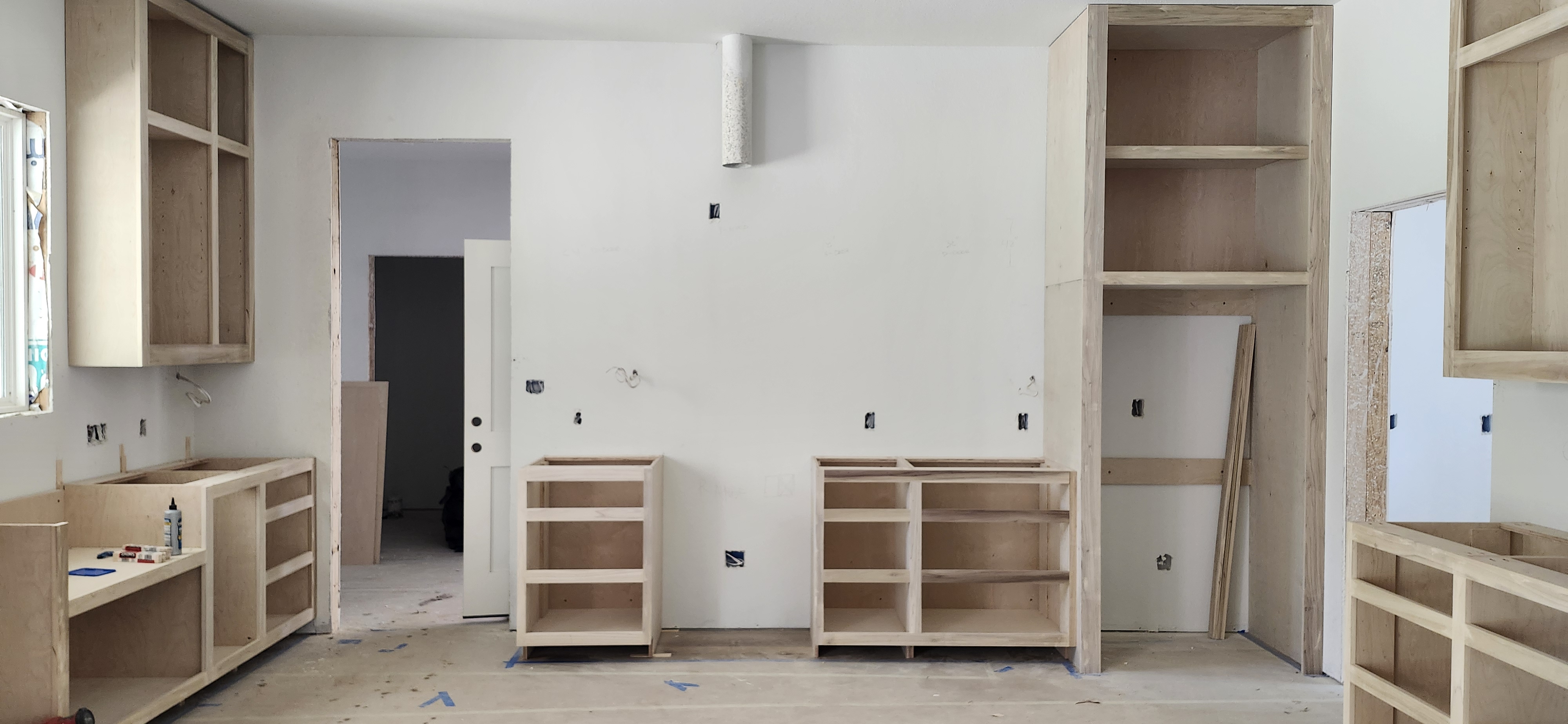 Full kitchen cabinet layout being installed on site