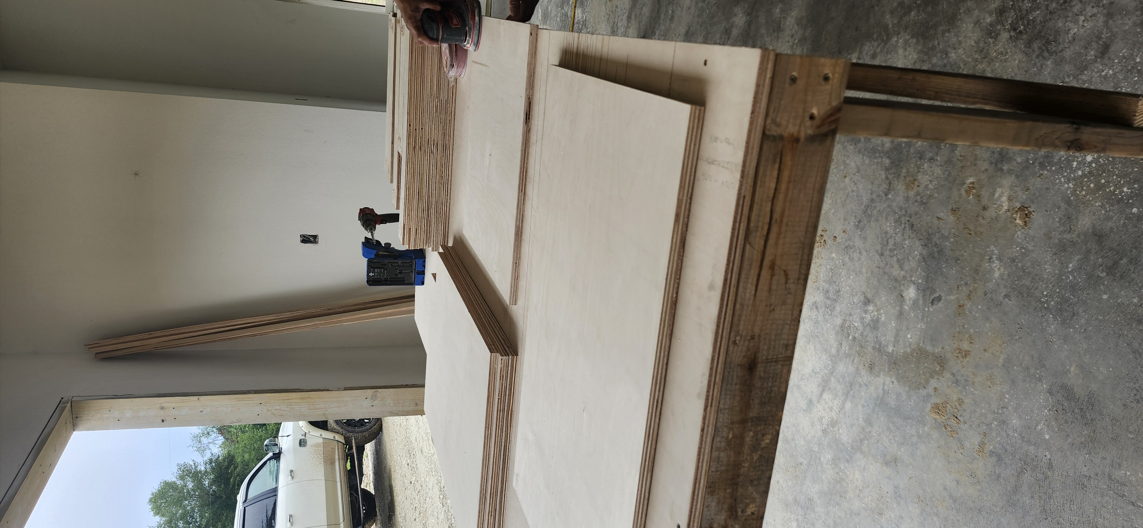 Custom cabinet panels being sanded and prepped in shop