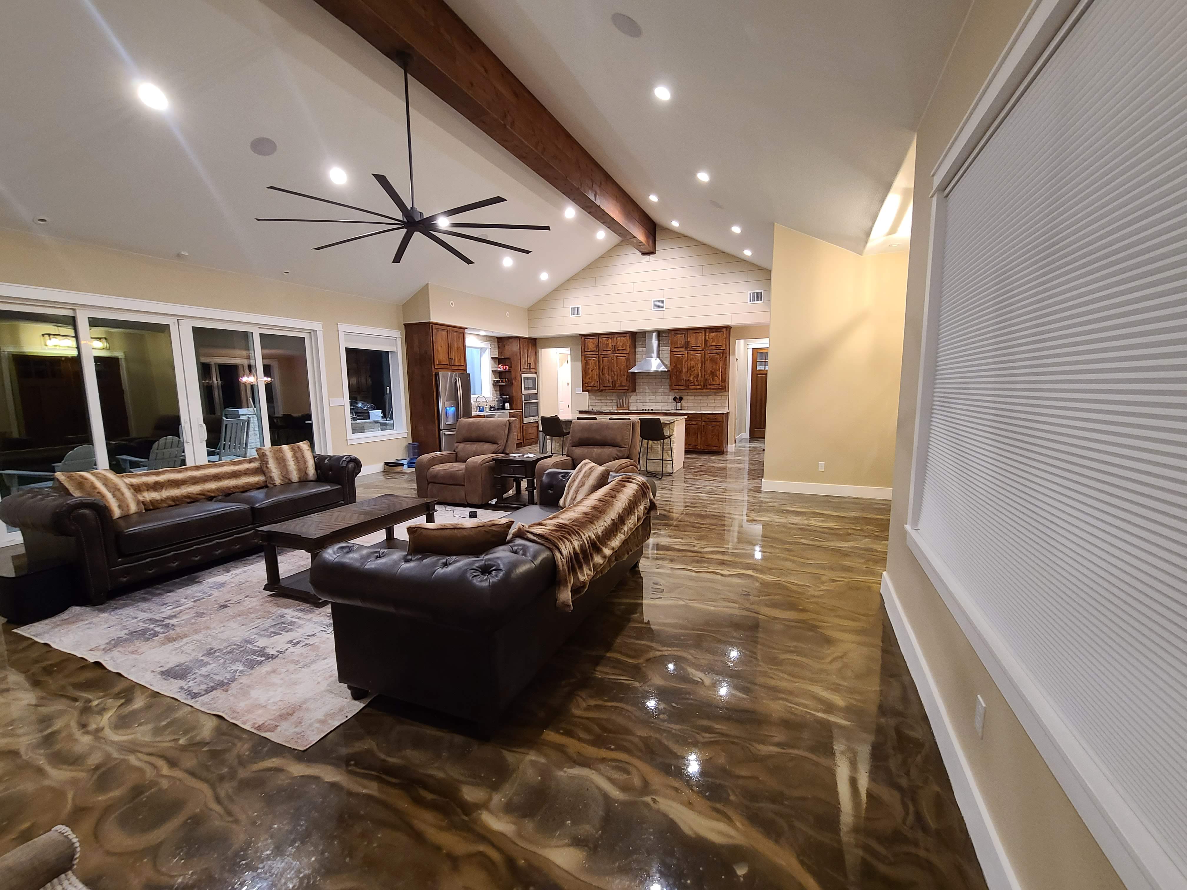 Living room vaulted ceiling exposed beam epoxy floor open plan